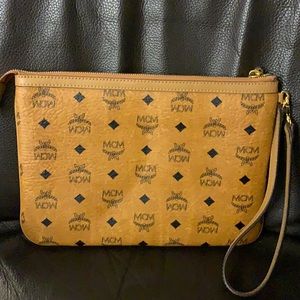 Brand new, never taken out of the house, wrist clutch by MCM was a gift